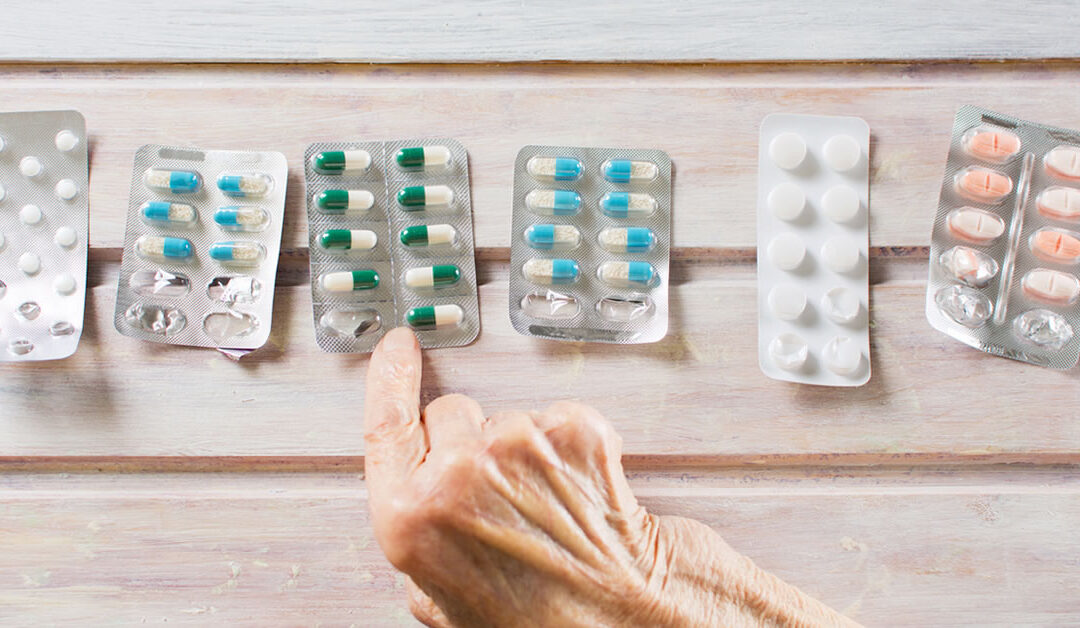 Nurse discussing medication with a senior patient